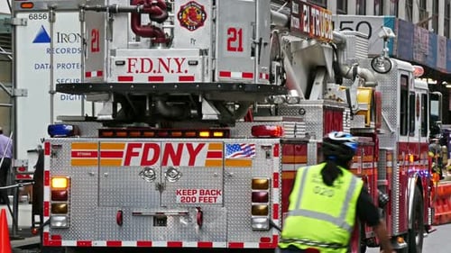 NEW YORK - OCTOBER 10, 2014: a Fire Truck and Firefighters On