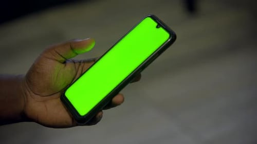 Hands Using Smartphone with Green Screen