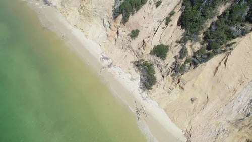 Aerial View Of Coastal Sand Cliffs And Sandy Shore In Rainbow Beach, Cooloola, Queensland. pullback