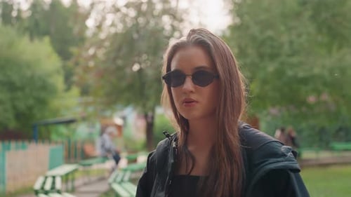 Cheerful Girl Smiling Vibrant Female with Braided Hair Expressing Joy Outside Park Energetic Young
