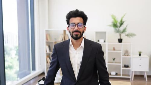 Smiling Businessman in Suit Gives Ok Hand Gesture