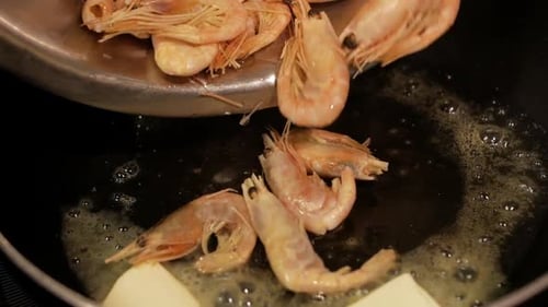 Frying Shrimps in a Pan with Oil and Spices in White Sauce