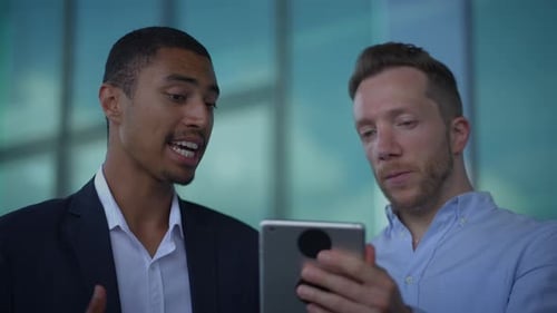 Business Professionals Engaging in Collaborative Activities While Utilizing Digital Devices