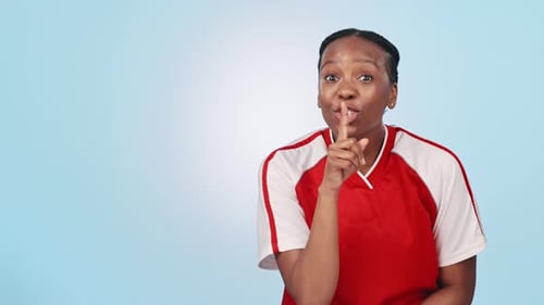 Secret, woman and hand on lips in sports for gossip, surprise or announcement on blue background