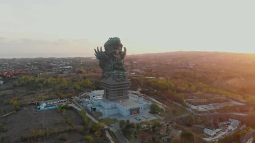 Aerial view of GWK statue at sunset, Indonesia.
