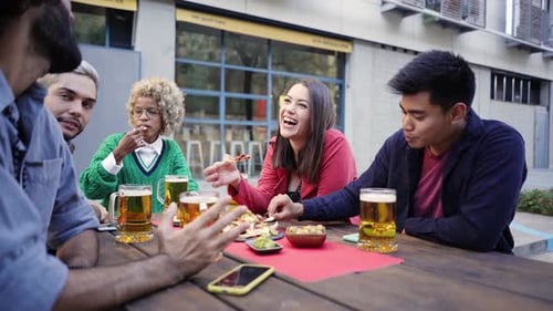 Friends Enjoying Food and Drinks Together Outside