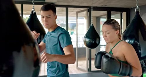 Woman Boxers with Her Trainer at the Gym