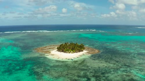Tropical Guyam Island with a Sandy Beach and Tourists