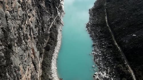 Aerial Above Laguna Paron Turquoise Water Peruvian Andes Lake Between Mountains and Pyramid Peak, Tr