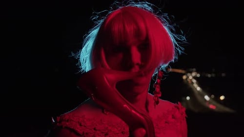 Intense Close-Up of Individual with High Heel Shoe