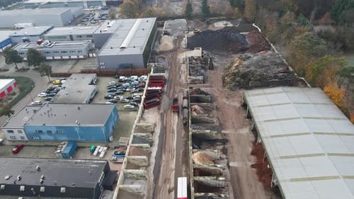 Aerial of sand quarry near a large industrial site