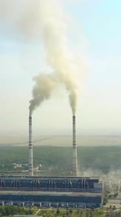 Air Polluting Factory. Factory with two chimneys and smoke