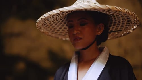 Woman in Straw Hat and Traditional Robe