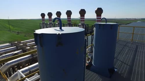 Gas production station. Metal construction with valves on the pipes. Distribution and equipment for