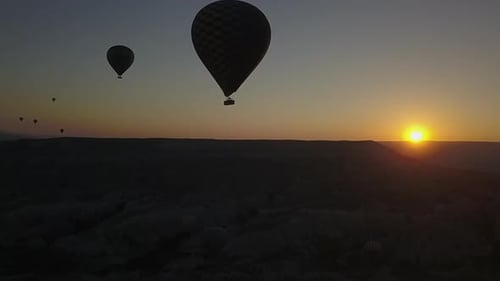Hot Air Balloons over Desert at Sunrise
