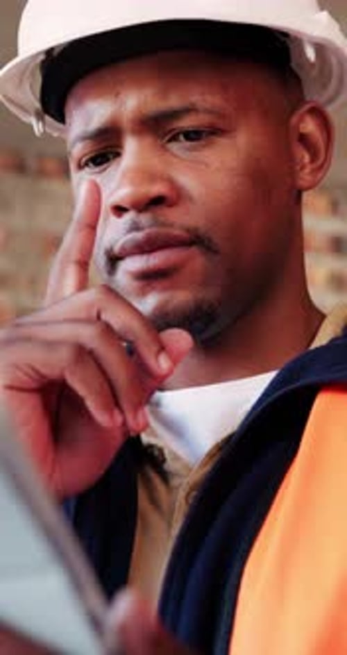 Civil engineer, thinking and black man with tablet in building, online and safety inspection on web