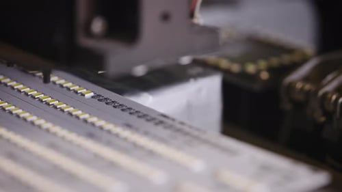 Robotic Arm Places Electronic Components on Assembly Line