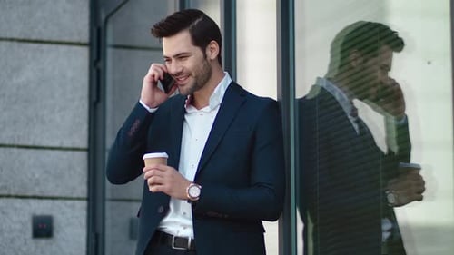 Close Up Handsome Businessman Standing With Take Away Coffee At Street. Confused Businessman Talk...