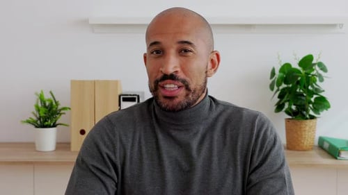 Close Up POV Man Talking with Colleague on Laptop Video Call Working From the Office