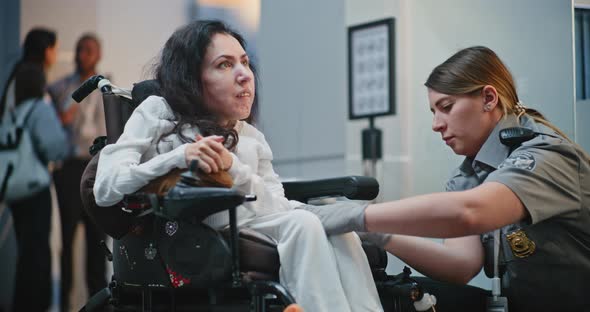 Security Checkpoint Female TSA Officer Checking Woman with Disability ...