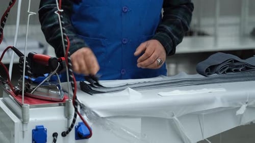Jeans Are Ironed At The Factory