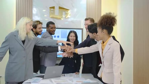 Diverse Business Team Celebrating Success in Modern Office