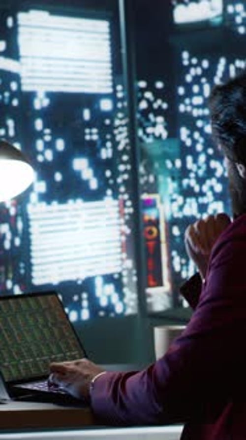 Person Working at Night in Modern Office