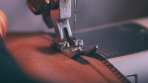 Sewing Machine Stitching Brown Fabric Seam Close-up