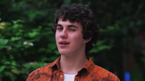 Young Adult Giving Thumbs Up in Nature