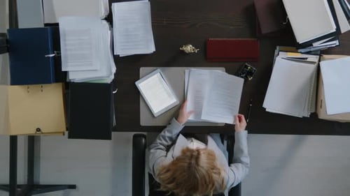 Lawyer Working with Documents at Office Desk