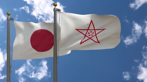 Waving Flags of Japan and City Against Blue Sky