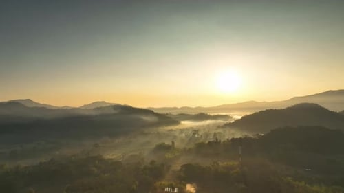 Aerial view Beautiful of morning scenery Golden light sunrise And the mist flows on high mountains.
