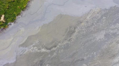 Aerial abstract pattern of acid mine drainage and mud, nature pollution, ecological bomb
