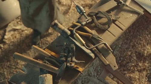 Vintage Hand Tools Arrayed on Rustic Wood Workbench