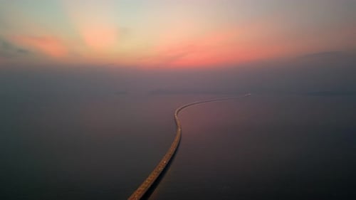 Aerial shots of the bridge in sea sunset