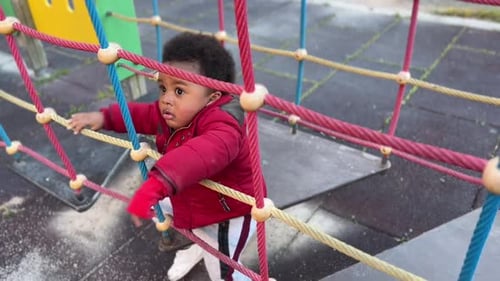 2 year old baby playing in the children park
