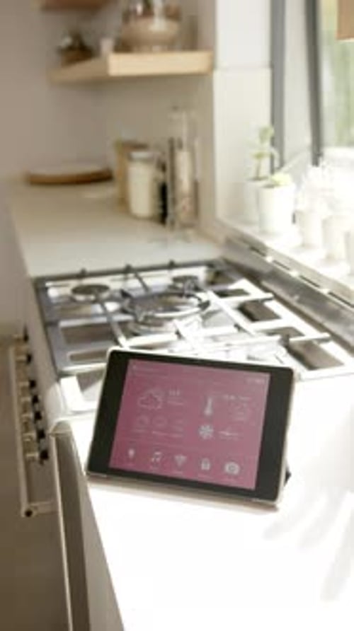 Tablet Controlling Smart Home Devices in Kitchen