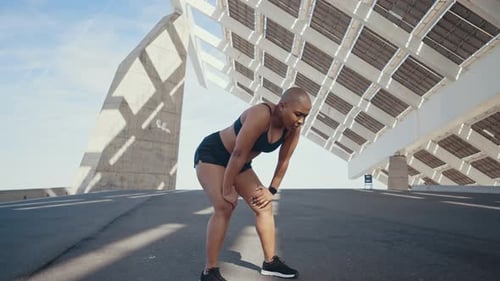 shaved woman making sport outdoor.