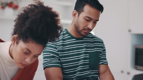 Young Adults Working Together at Home at White Table