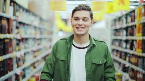 Attractive Man Walk with Shopping Cart at the Supermarket Happy Hypermarket Hand Food Shop Store