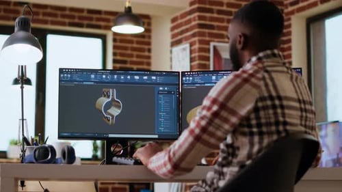 Un designer industriel afro-américain travaille sur des prototypes dans un studio de création