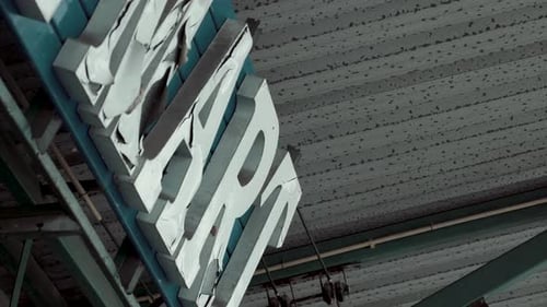 Old Broken Cracked MART Sign on Supermarket Building