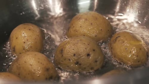 Small Potatoes Boiling in a Stainless Steel Pot