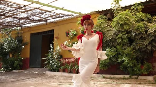 Elegant Woman in Traditional Dress Dancing in Courtyard