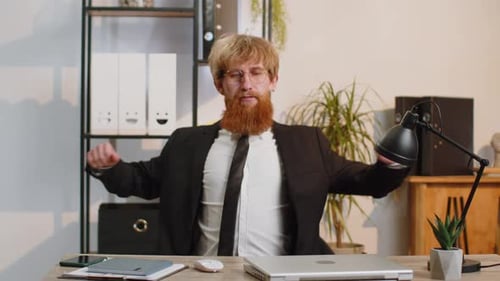Young Business Man Freelancer at Office Start Working on Laptop Computer Sends Online Messages
