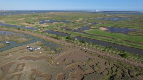 Boats in Marshy Swamps of Blackwater River, Essex, UK - Aerial Drone View