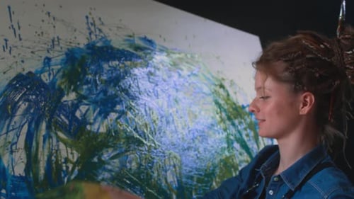 Woman Creates Abstract Art With Fingers in Studio