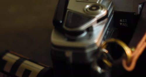 Dolly of Vintage and Antique 35mm Cameras and Equipment slow slide past camera wrapped in leather ne