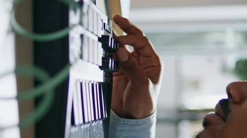 Hand Adjusting Knob on an Audio Panel