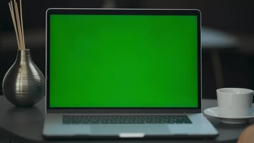 Empty Chroma Key Laptop on Contemporary Workplace Closeup